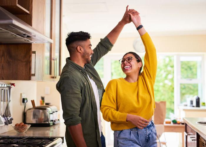 couple dancing in the kitchen